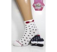 Жіночі шкарпетки DUCKS SOCKS середньої висоти Арт.:8005.60-7 / Горошок+ вишневий бантик /